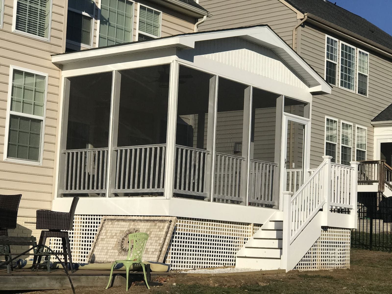 Screened porch addition on the back of a two-story home in Vienna, VA, by Vale Construction